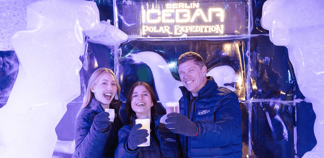 Berlin Icebar 2 Women and 1 Man Smiling with Iceglasses1327x649